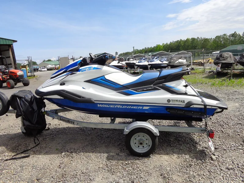 Slide: The Image of 2019 Yamaha FX Cruiser HO jet ski on trailer, parked outdoors. - 3