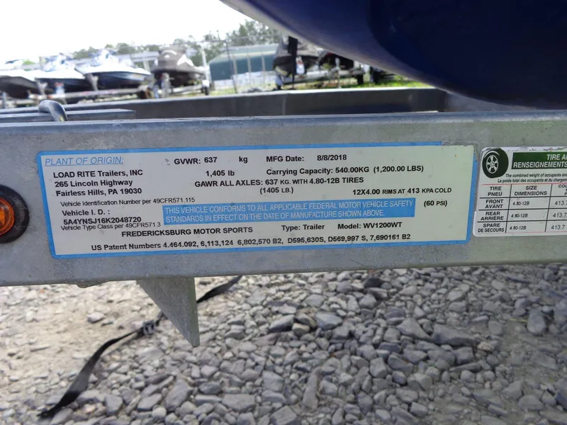 Slide: The Image of Trailer label for Load Rite Trailers, Inc., showing specifications and compliance details. - 35