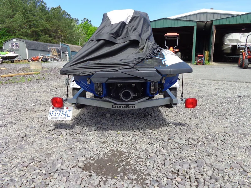 Slide: The Image of 2019 Yamaha FX Cruiser HO on trailer, covered, parked on gravel near storage facility. - 37