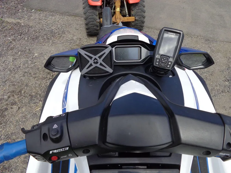 Slide: The Image of 2019 Yamaha FX Cruiser HO dashboard with GPS and speaker, parked on gravel. - 7