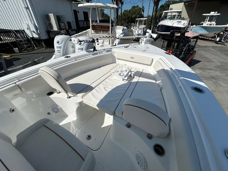 Slide: The Image of 2022 Sea Hunt Gamefish 25 boat with spacious seating and modern design. - 2