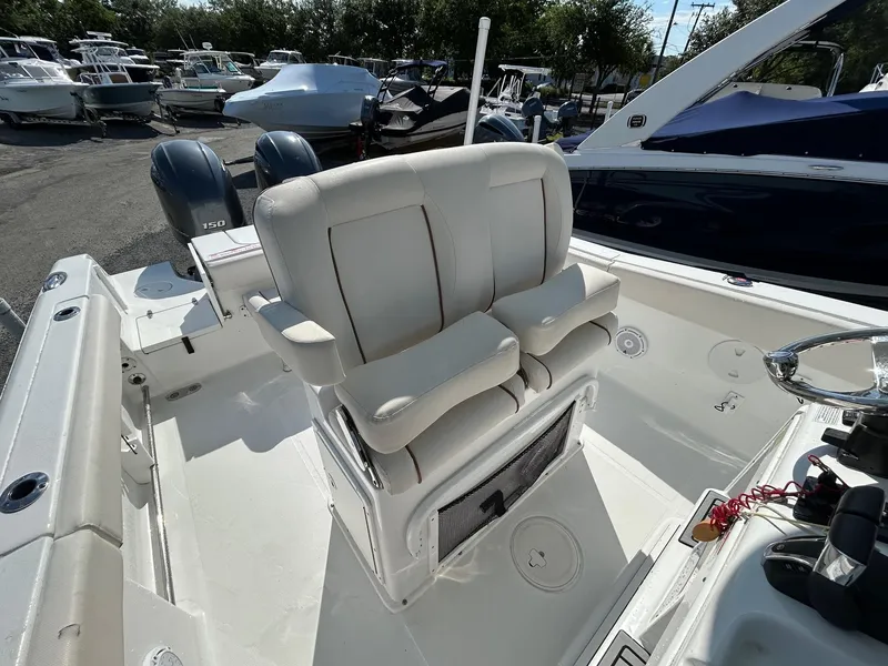 Slide: The Image of 2022 Sea Hunt Gamefish 25 boat interior with dual seats and twin engines. - 6