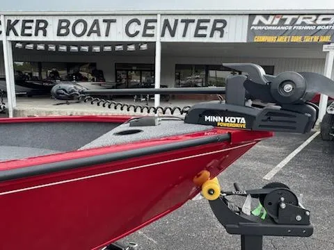Slide: The Image of Red 2025 Tracker Super Guide V-16 T boat with Minn Kota motor at Tracker Boat Center. - 3