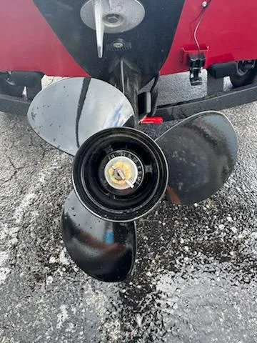 Slide: The Image of Propeller of 2025 Tracker Super Guide V-16 T boat on wet pavement. - 8