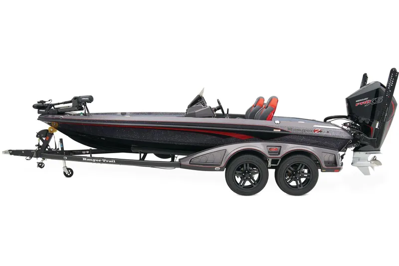 Slide: The Image of 2025 Ranger Z519R boat on trailer, parked outdoors with sunlight reflections. - 2