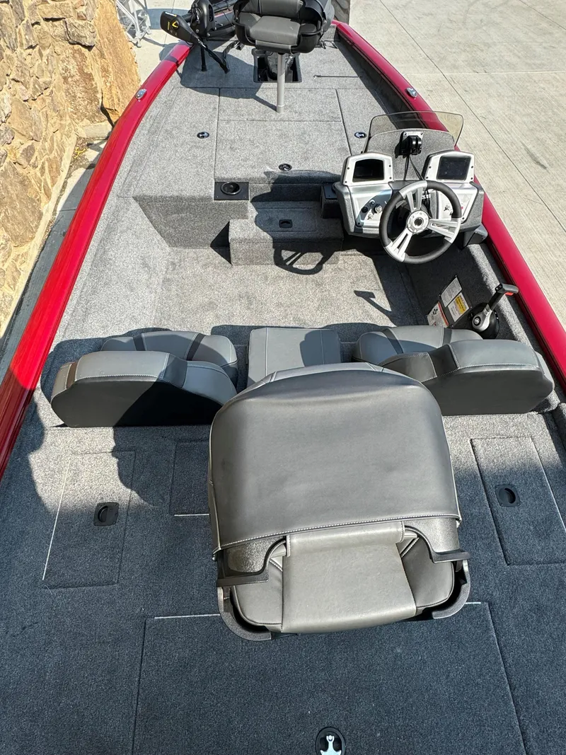 Slide: The Image of 2025 Tracker Pro Team 175 boat interior with steering console and seating. - 3