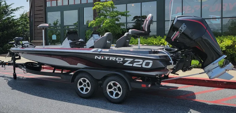 Slide: The Image of 2025 Nitro Z20 XL Pro boat on trailer, dealership offers trade-ins. - 0