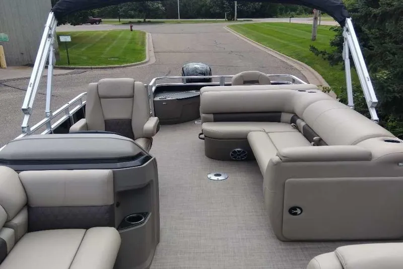 Slide: The Image of 2025 Sun Tracker SportFish 20 DLX pontoon boat with spacious seating and modern design. - 4