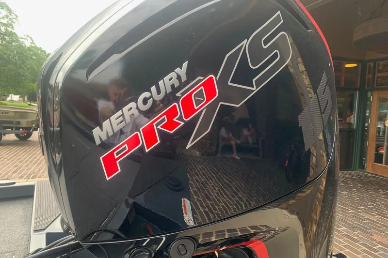 Slide: The Image of Mercury Pro XS engine on a 2025 Ranger RT188 boat, parked on a brick driveway. - 3