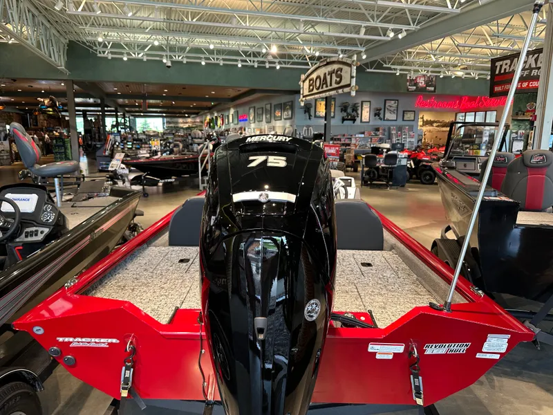 Slide: The Image of 2025 Tracker Pro Team 175 boat with Mercury 75 engine in showroom. - 3