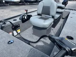 Slide: The Image of 2025 Tracker Panfish 17 boat interior with seating and control panel. - 6