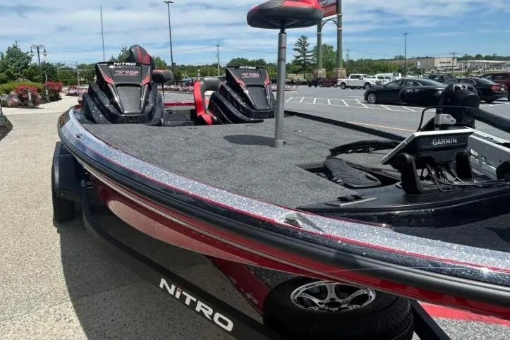 Slide: The Image of 2025 Nitro Z19 Pro boat with sleek design, parked outdoors. - 2