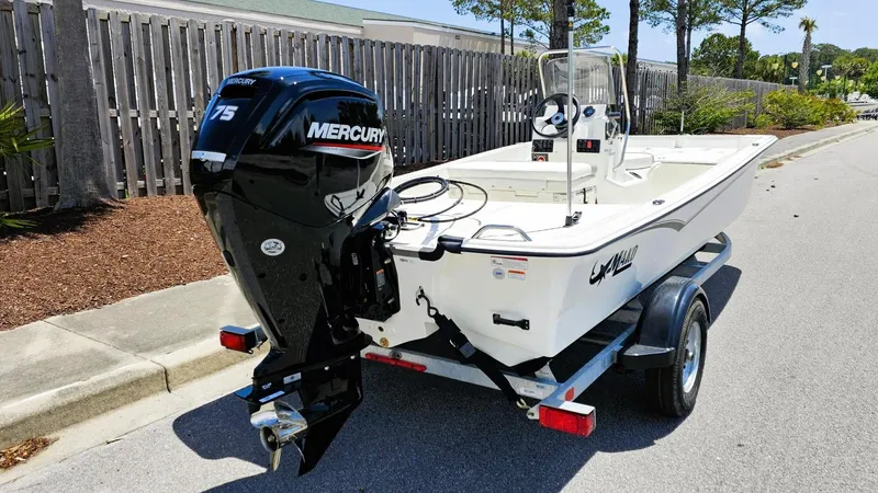 Slide: The Image of 2025 Mako Pro Skiff 17 CC boat on trailer with Mercury 75 engine. - 4