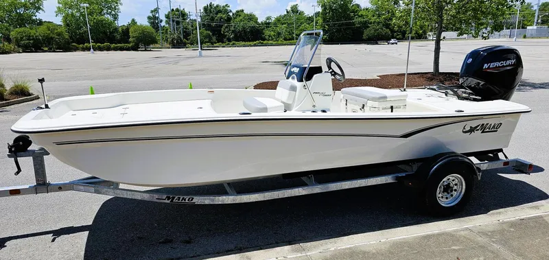Slide: The Image of 2025 Mako Pro Skiff 17 CC boat on trailer in parking lot. - 6