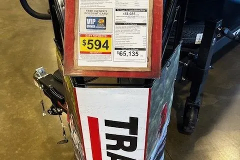 Slide: The Image of 2025 Tracker Savage 215 boat display with pricing details and promotional offers. - 2