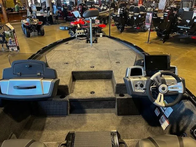 Slide: The Image of Interior view of 2025 Tracker Savage 215 boat, showcasing steering console and seating. - 3