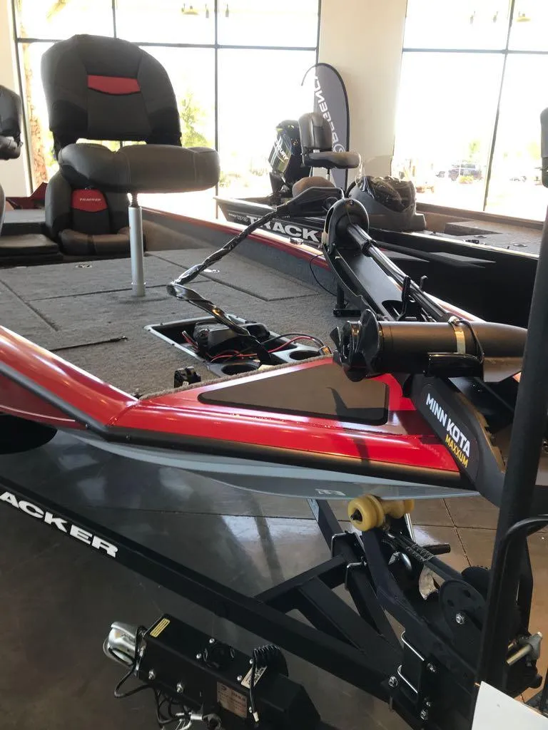 Slide: The Image of 2025 Tracker Pro Team 175 boat with Minn Kota trolling motor in showroom. - 4