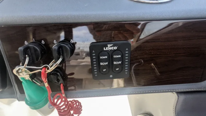 Slide: The Image of Control panel of 2020 Chaparral 280 OSX boat with Lenco trim tab switches. - 10
