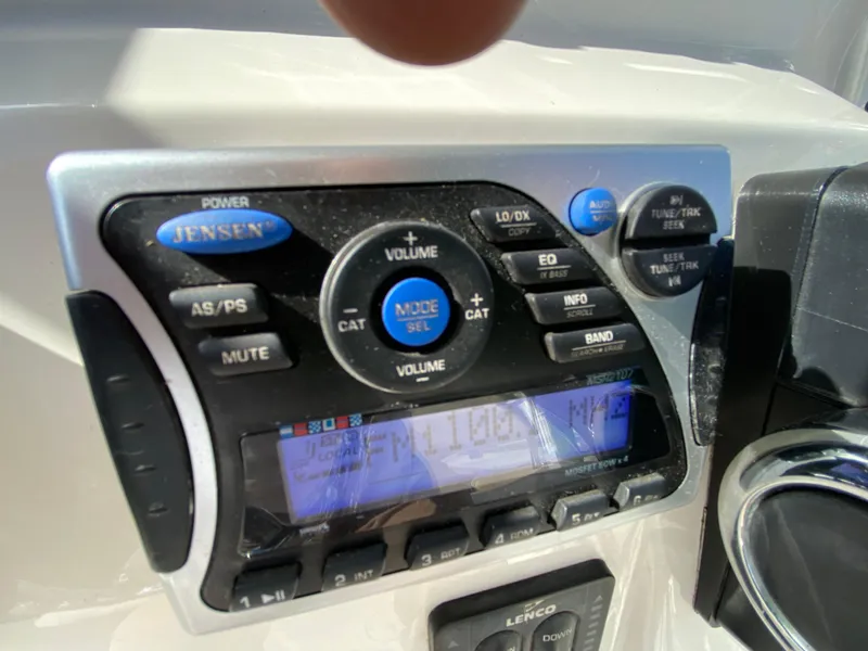 Slide: The Image of Jensen audio system on 2011 Pursuit C 200 Center Console boat dashboard. - 29