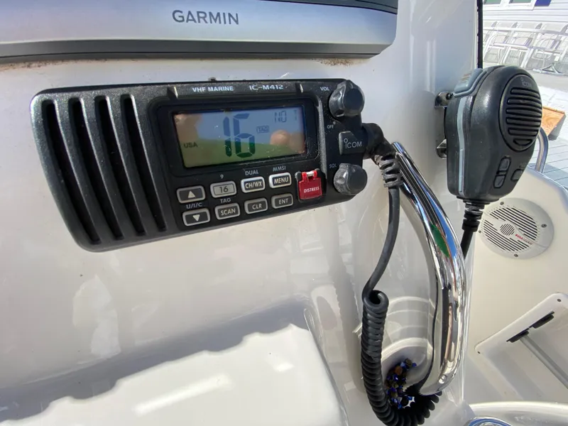 Slide: The Image of VHF marine radio and microphone on 2011 Pursuit C 200 Center Console boat. - 30