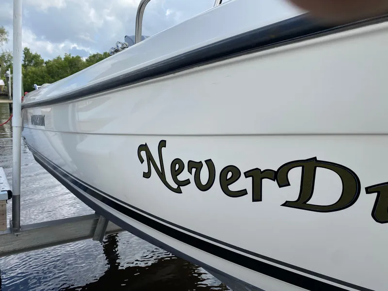 Slide: The Image of 2011 Pursuit C 200 Center Console boat with "Never D" name on the side. - 42