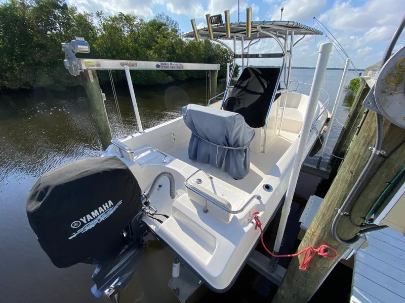 Slide: The Image of 2011 Pursuit C 200 Center Console boat docked with Yamaha outboard motor. - 6