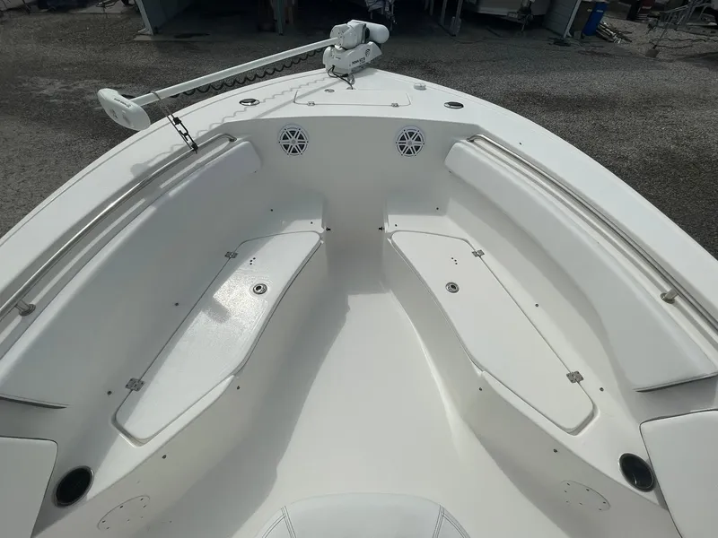 Slide: The Image of 2019 Tidewater 220 CC Adventure boat interior with seating and storage compartments. - 13