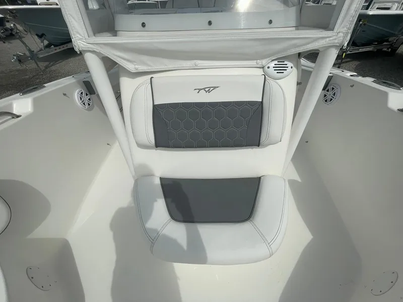 Slide: The Image of 2019 Tidewater 220 CC Adventure boat interior with cushioned seating and modern design. - 17