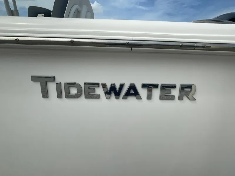 Slide: The Image of 2019 Tidewater 220 CC Adventure boat logo on white surface. - 2