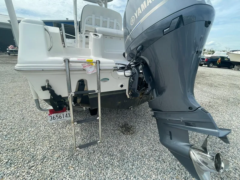 Slide: The Image of 2019 Tidewater 220 CC Adventure boat with Yamaha outboard motor and ladder on gravel. - 37