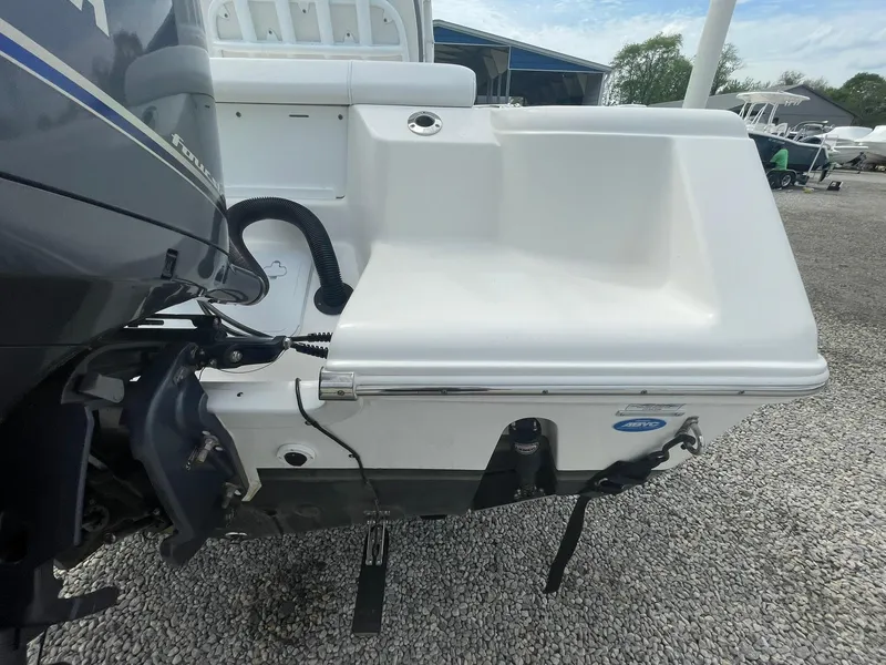 Slide: The Image of 2019 Tidewater 220 CC Adventure boat stern view with motor and swim platform. - 38