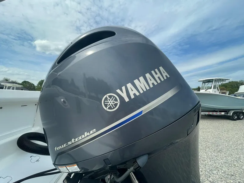 Slide: The Image of Yamaha outboard motor on 2019 Tidewater 220 CC Adventure boat under blue sky. - 40