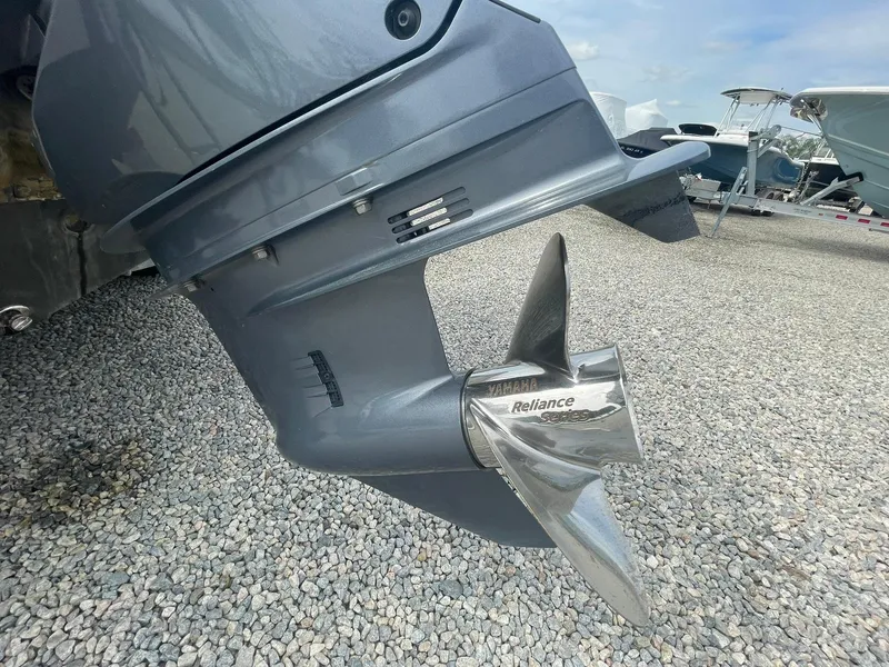 Slide: The Image of 2019 Tidewater 220 CC Adventure boat propeller on gravel surface. - 42