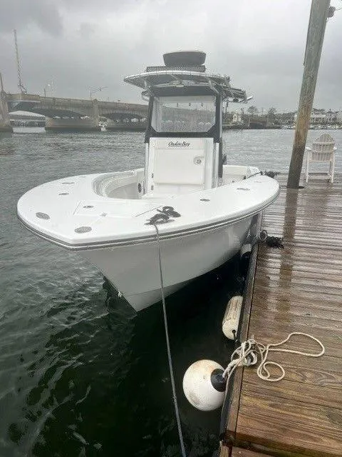 Slide: The Image of 2023 Onslow Bay 27 Offshore boat docked on a cloudy day. - 3