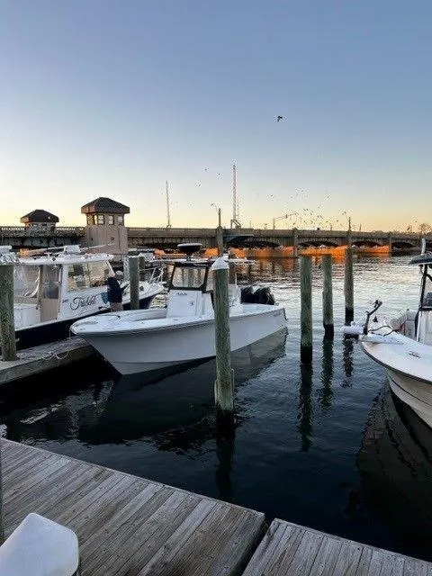 Slide: The Image of 2023 Onslow Bay 27 Offshore boat docked at marina during sunset. - 4