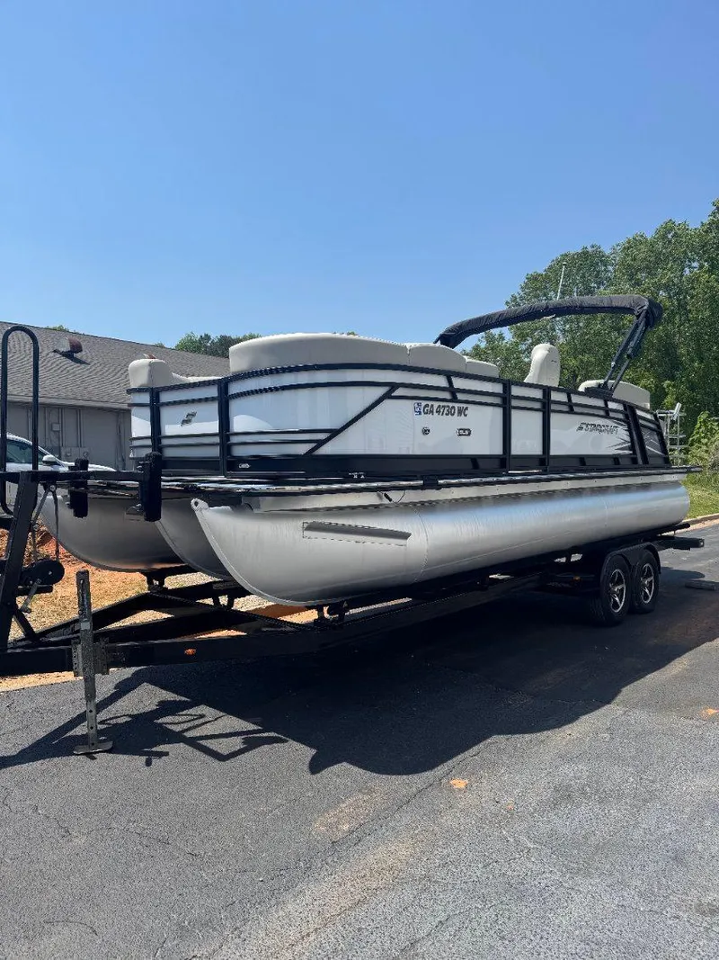 Slide: The Image of 2022 Starcraft SLS 3 Q DH pontoon boat on trailer, parked outdoors. - 12