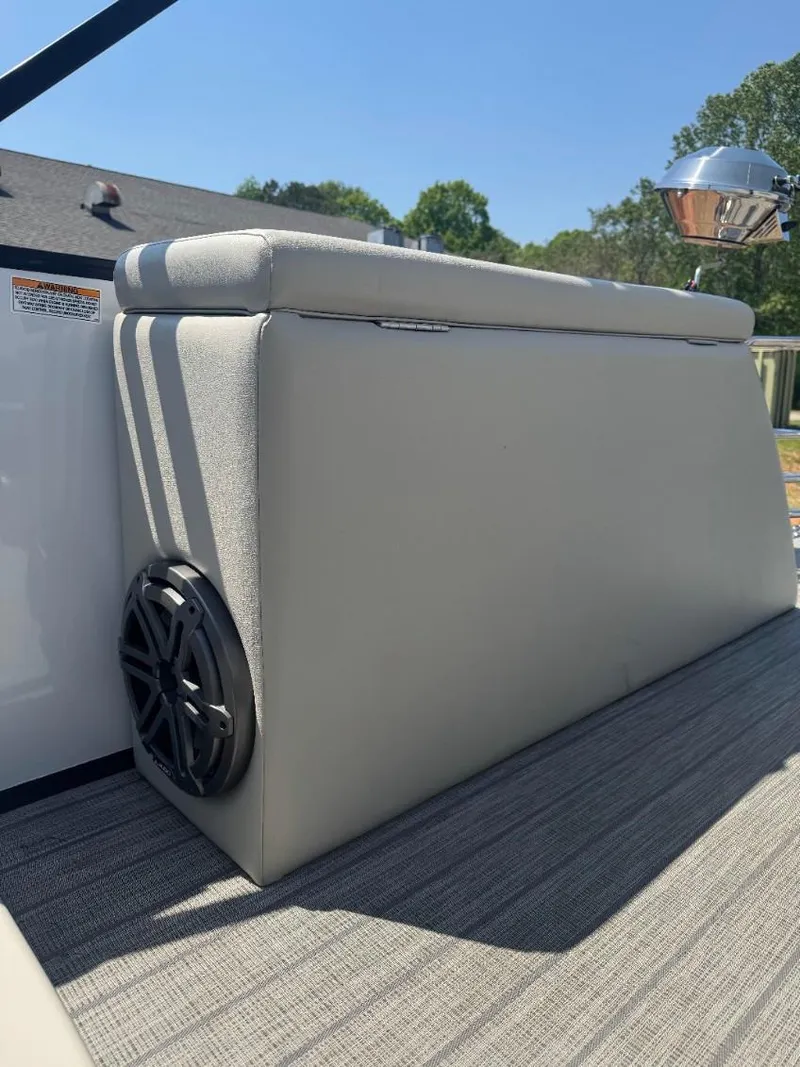 Slide: The Image of 2022 Starcraft SLS 3 Q DH boat seat with speaker, outdoor setting. - 14