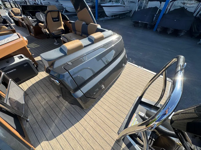 Slide: The Image of 2025 Avalon Excalibur 27' boat interior with luxurious seating and modern design. - 24