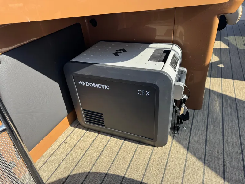 Slide: The Image of Portable Dometic CFX cooler on Avalon Excalibur 27' boat, 2025 model. - 27