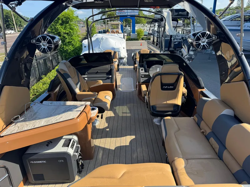 Slide: The Image of Luxurious 2025 Avalon Excalibur 27' boat interior with plush seating and modern amenities. - 29