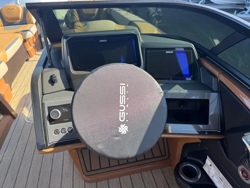 Slide: The Image of Control panel of 2025 Avalon Excalibur 27' boat with Gussi Italia steering wheel. - 32