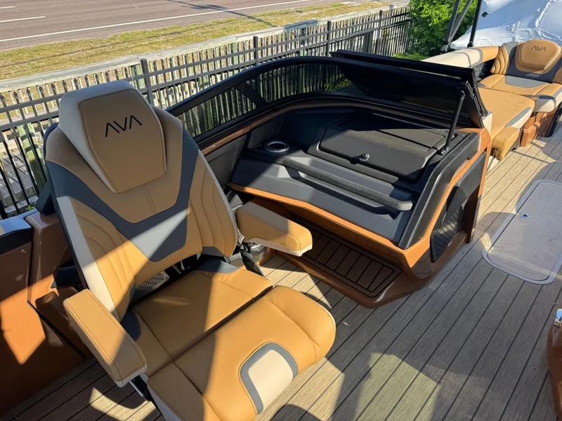 Slide: The Image of Luxurious 2025 Avalon Excalibur 27' boat interior with tan leather seating and sleek design. - 33