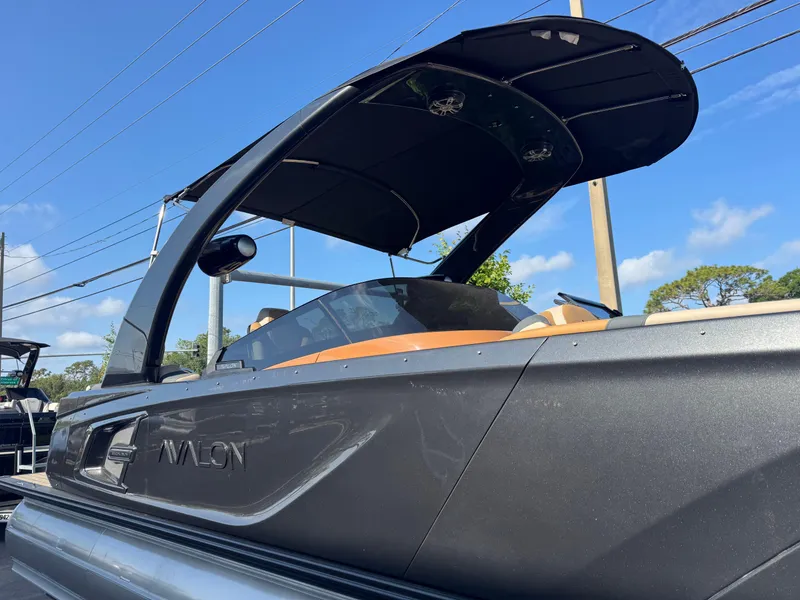 Slide: The Image of 2025 Avalon Excalibur 27' boat with sleek design and modern canopy. - 4