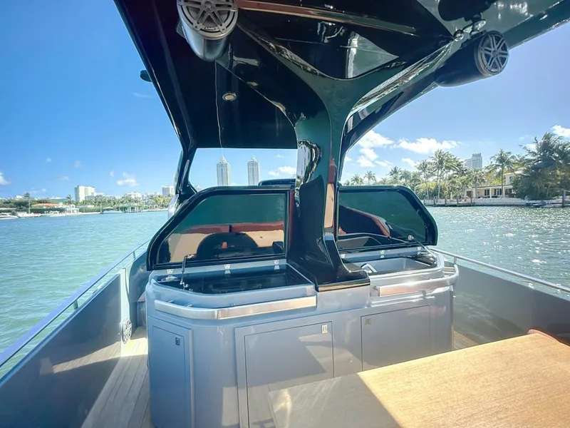 Slide: The Image of 2019 SACS Rebel 40 boat with sleek design on a sunny waterfront. - 20
