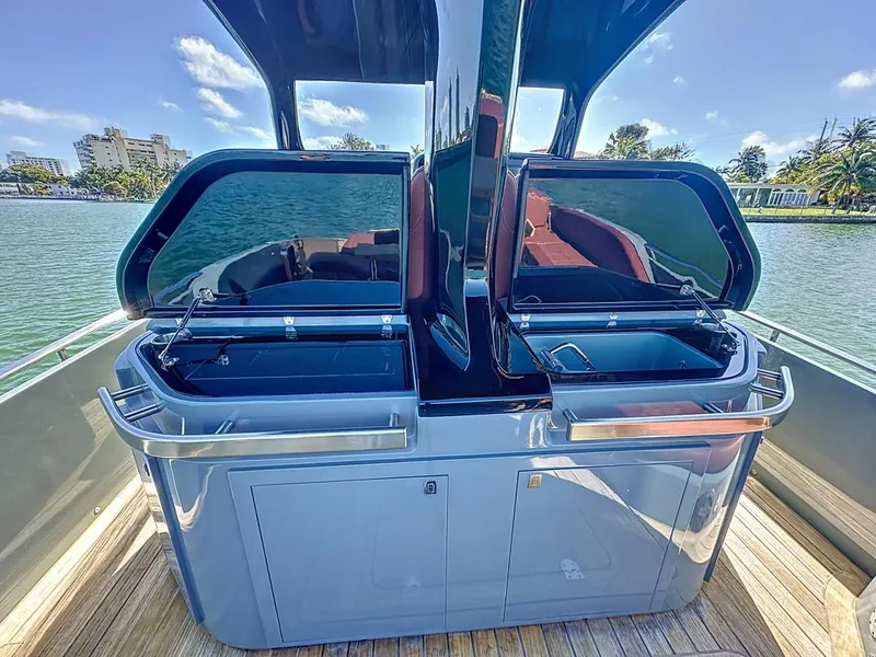 Slide: The Image of 2019 SACS Rebel 40 yacht with sleek outdoor kitchen on deck, featuring dual sinks and storage. - 21