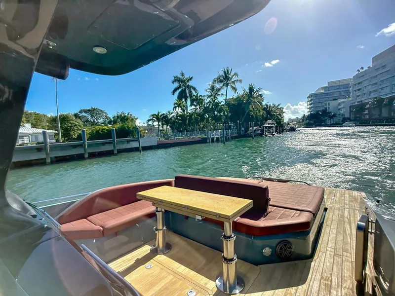 Slide: The Image of Luxurious 2019 SACS Rebel 40 yacht with elegant seating, cruising in sunny waters. - 8