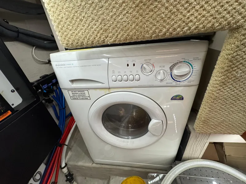 Slide: The Image of 25 2004 Sea Ray 390 Under Stairs Laundry - 26