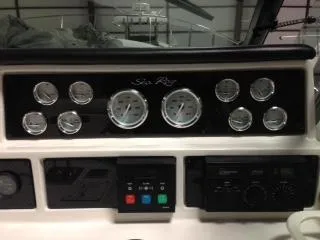 Slide: The Image of 1990 Sea Ray 390 Express Cruiser dashboard with gauges and controls. - 21