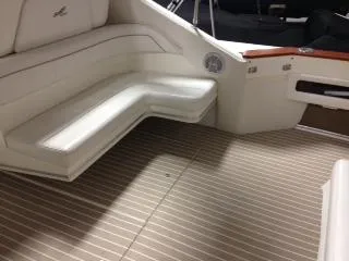 Slide: The Image of 1990 Sea Ray 390 Express Cruiser interior with white seating and striped flooring. - 46
