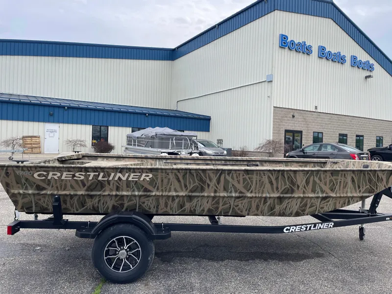 The Image of 2025 Crestliner 1760 Retriever Jon Deluxe boat on trailer outside dealership. - 0